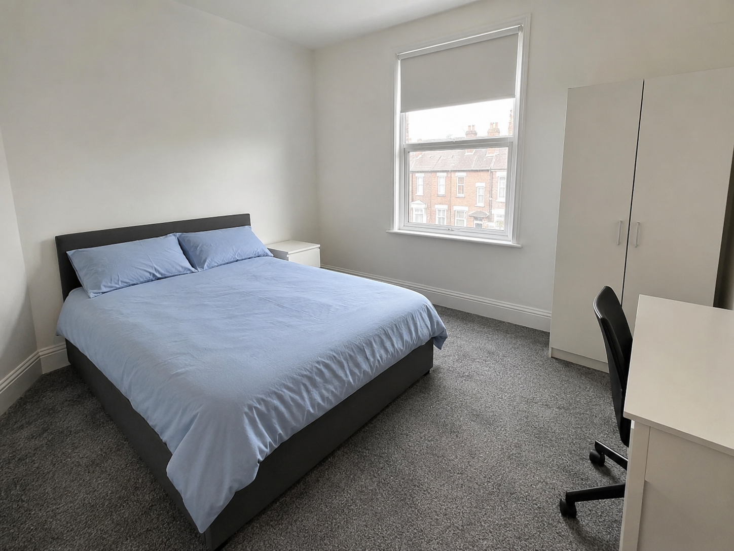 Minimal Daylit Bedroom with City View.png