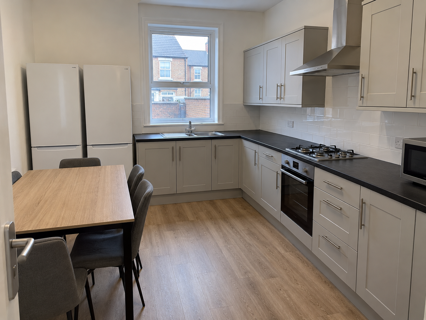 Modern Gray Galley Kitchen Dining Area.png