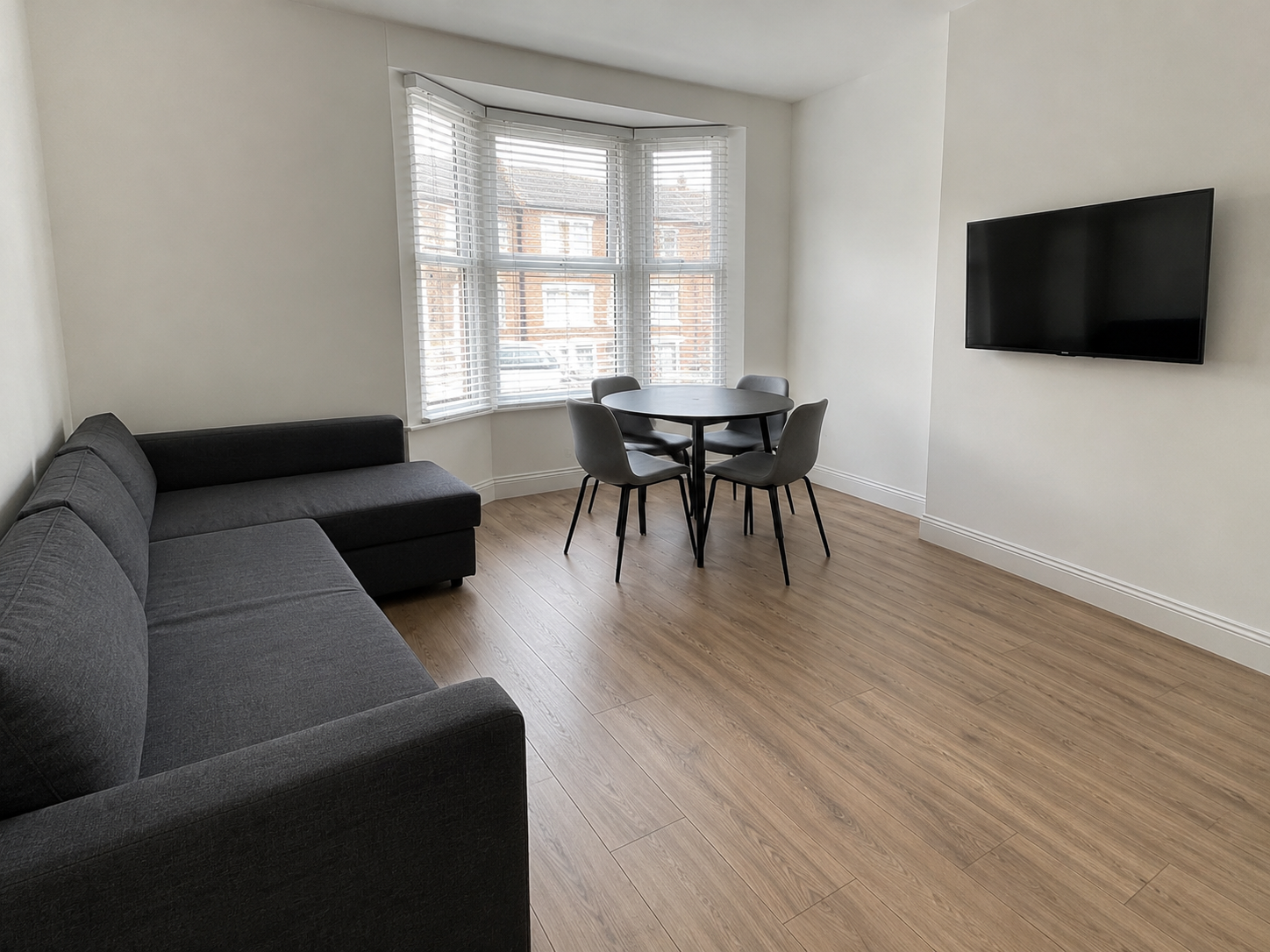 Minimalist Living Room with Bay Window.png