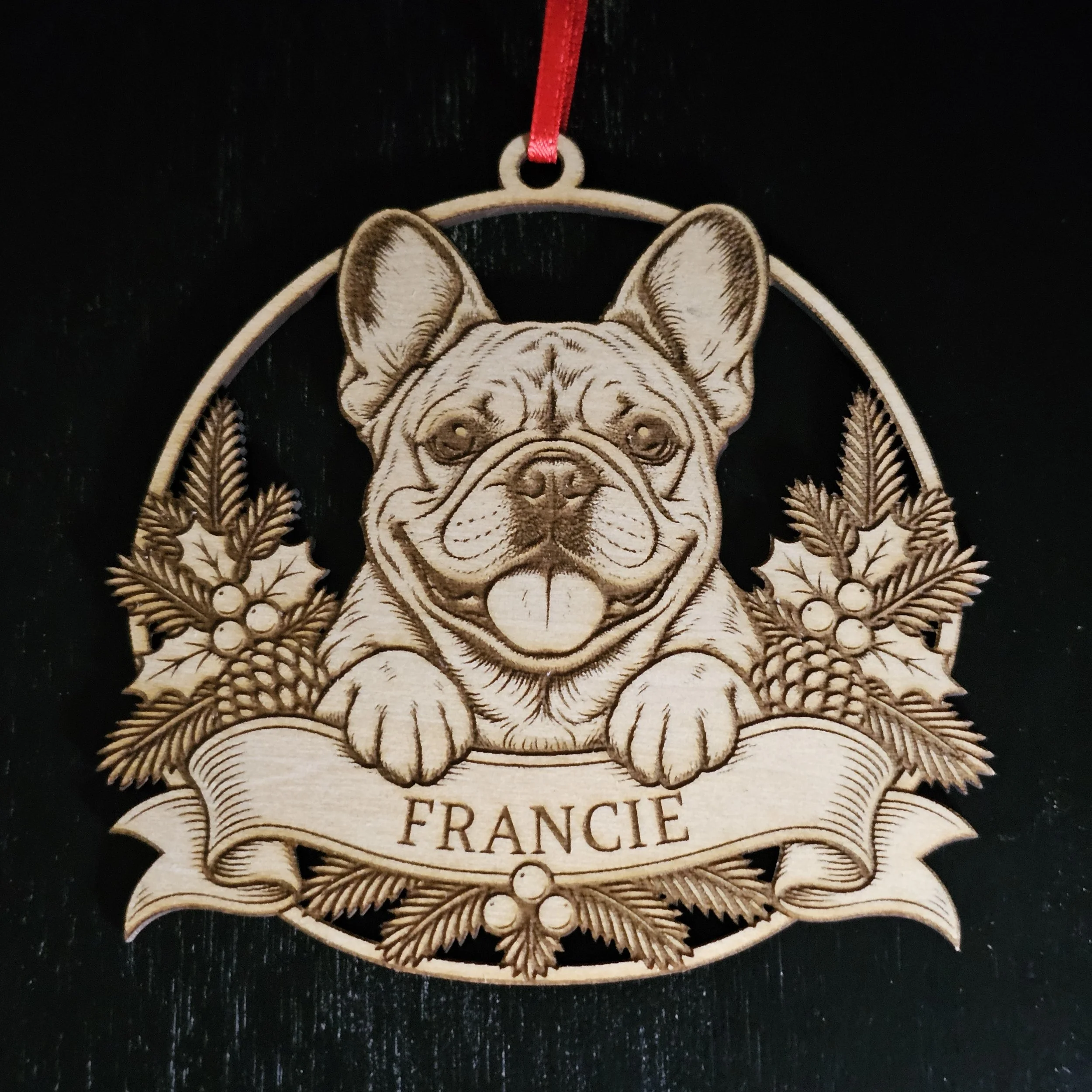 French Bulldog ornament with name detail against solid black background.