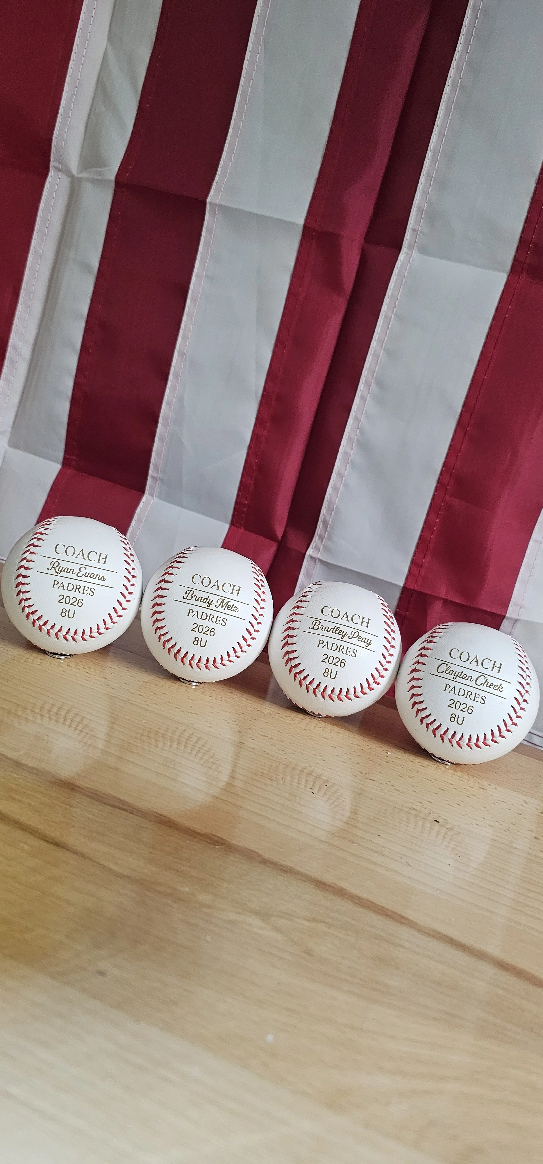 A batch of custom ordered engraved baseballs.