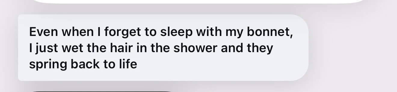 Text message saying: "Even when I forget to sleep with my bonnet, I just wet the hair in the shower and they spring back to life".