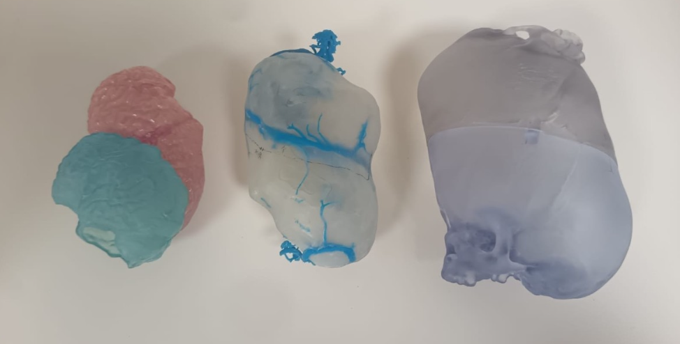 Three colorful slime blobs in pink, blue, and gray on a white background.