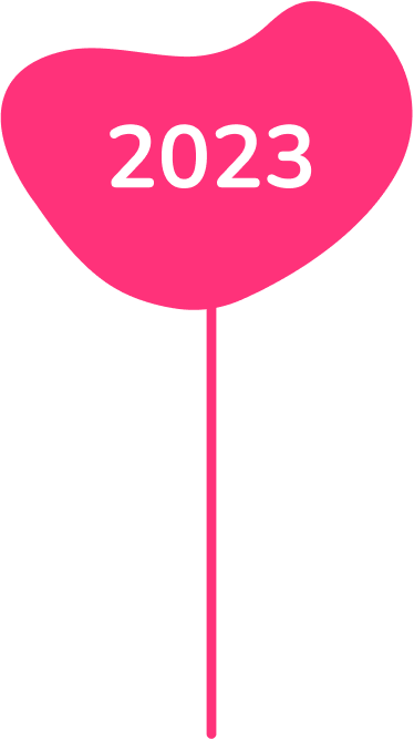 Pink heart-shaped balloon with the year '2023' written on it.