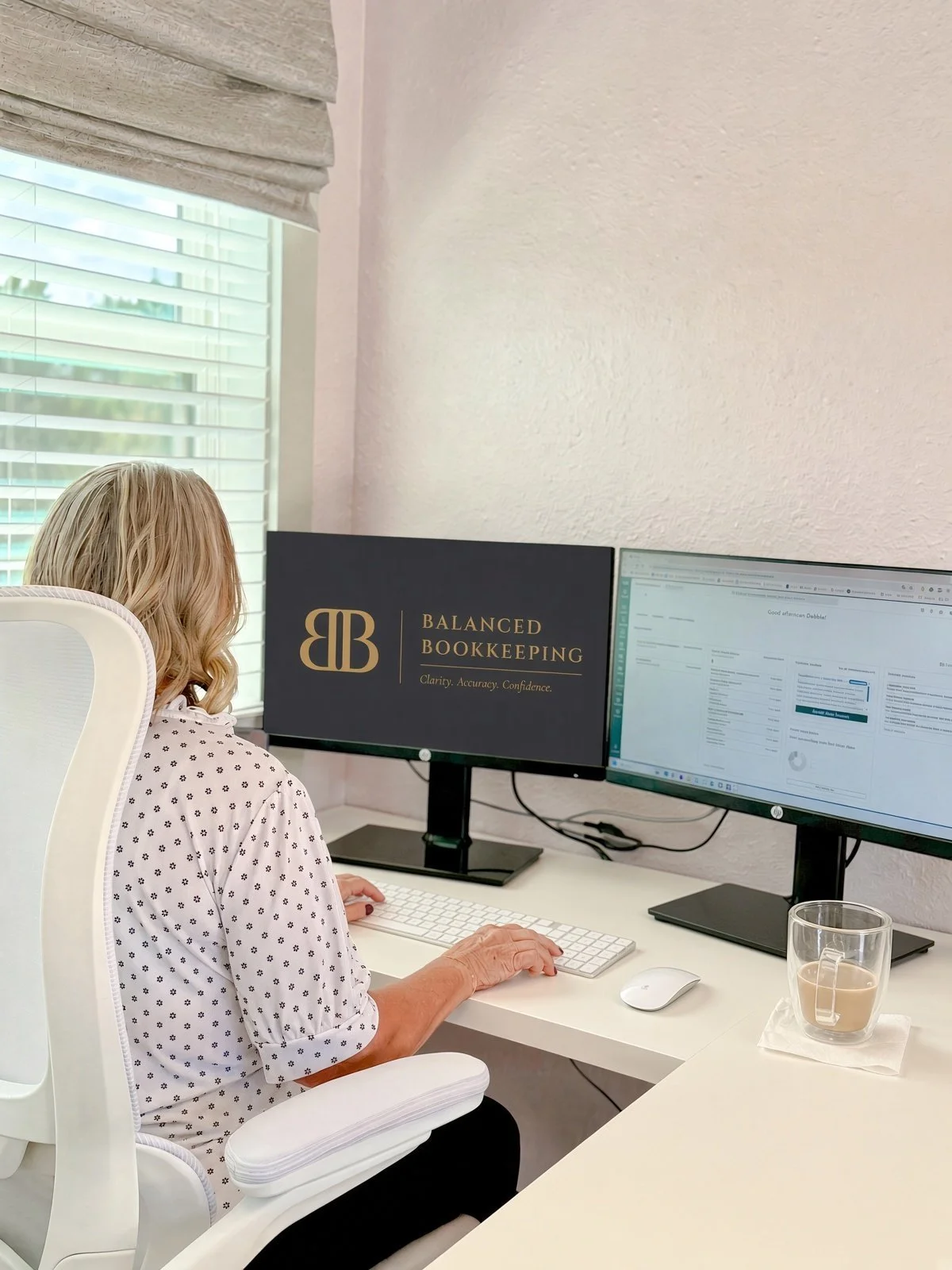 Debbie Boeddeker of Balanced Bookkeeping at her desk in Spring Branch, TX