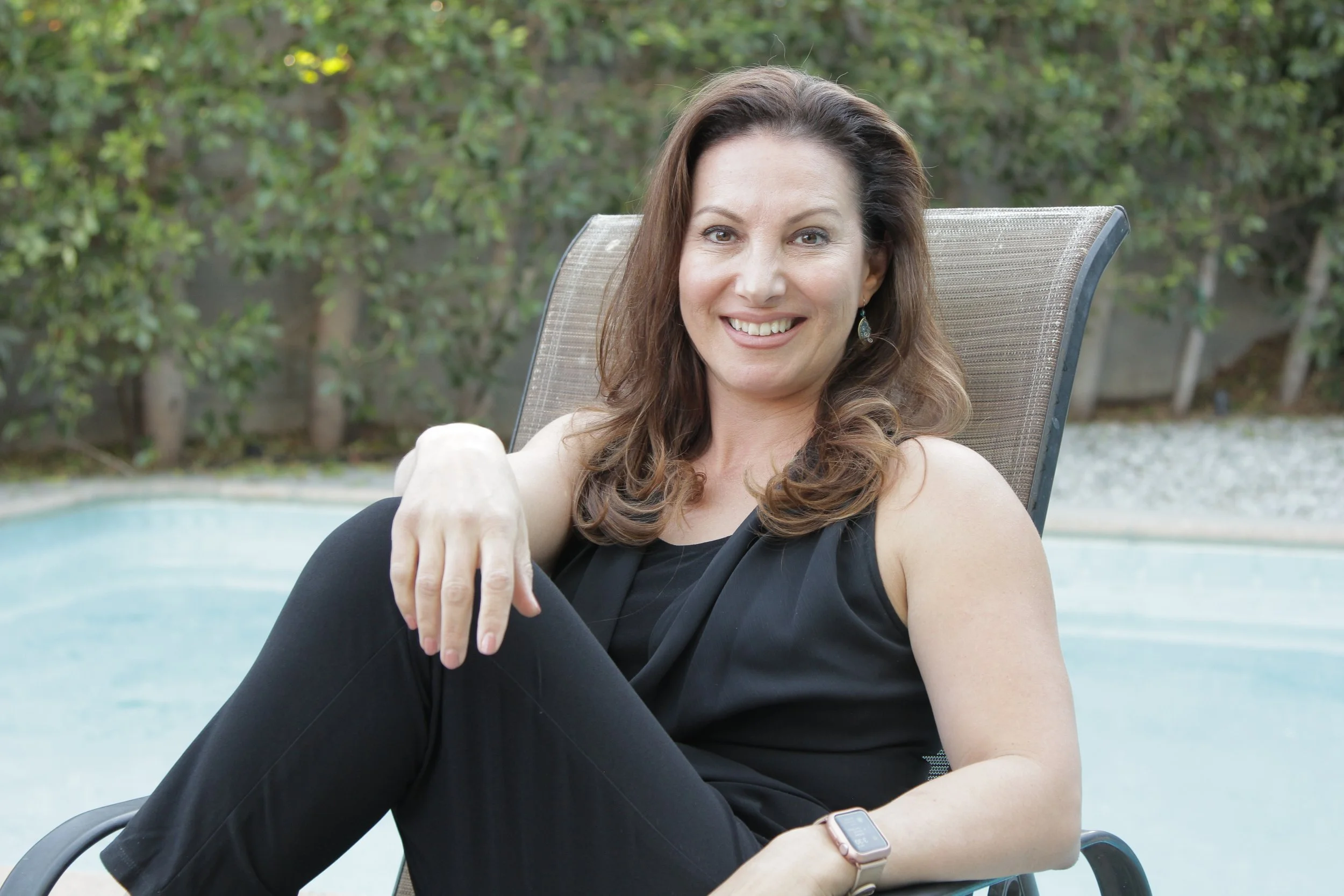 Maribel Dugas, LCSW, Zen & Health, Maribel, wearing a black pantsuit, nature background