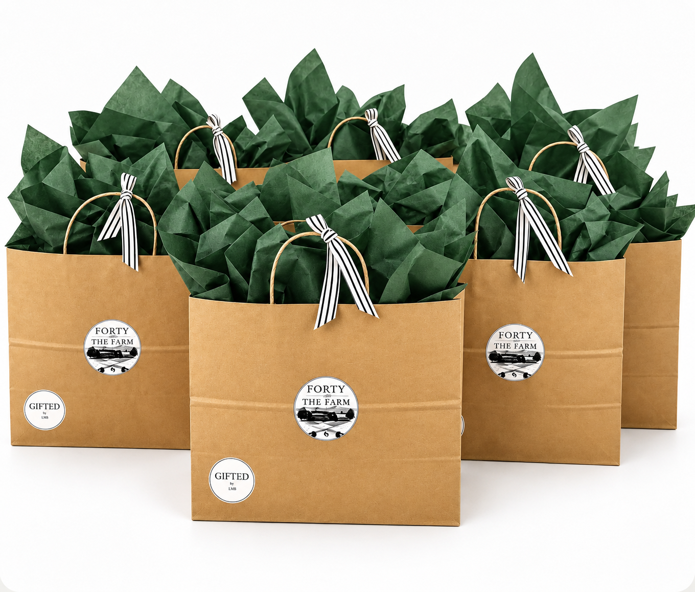 Four brown paper gift bags with green tissue paper and black and white striped ribbons, labeled "Forty and The Farm," on a white background.
