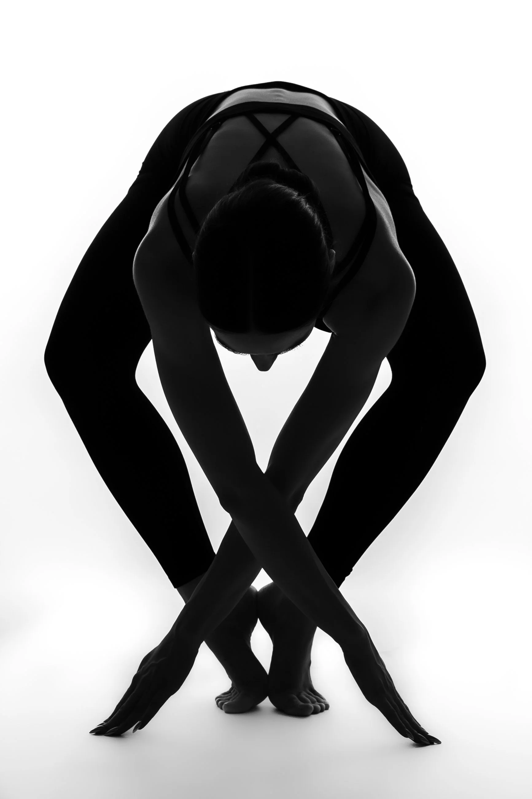 Black and white sculpture of multiple human bodies intertwined, creating a complex and abstract form.