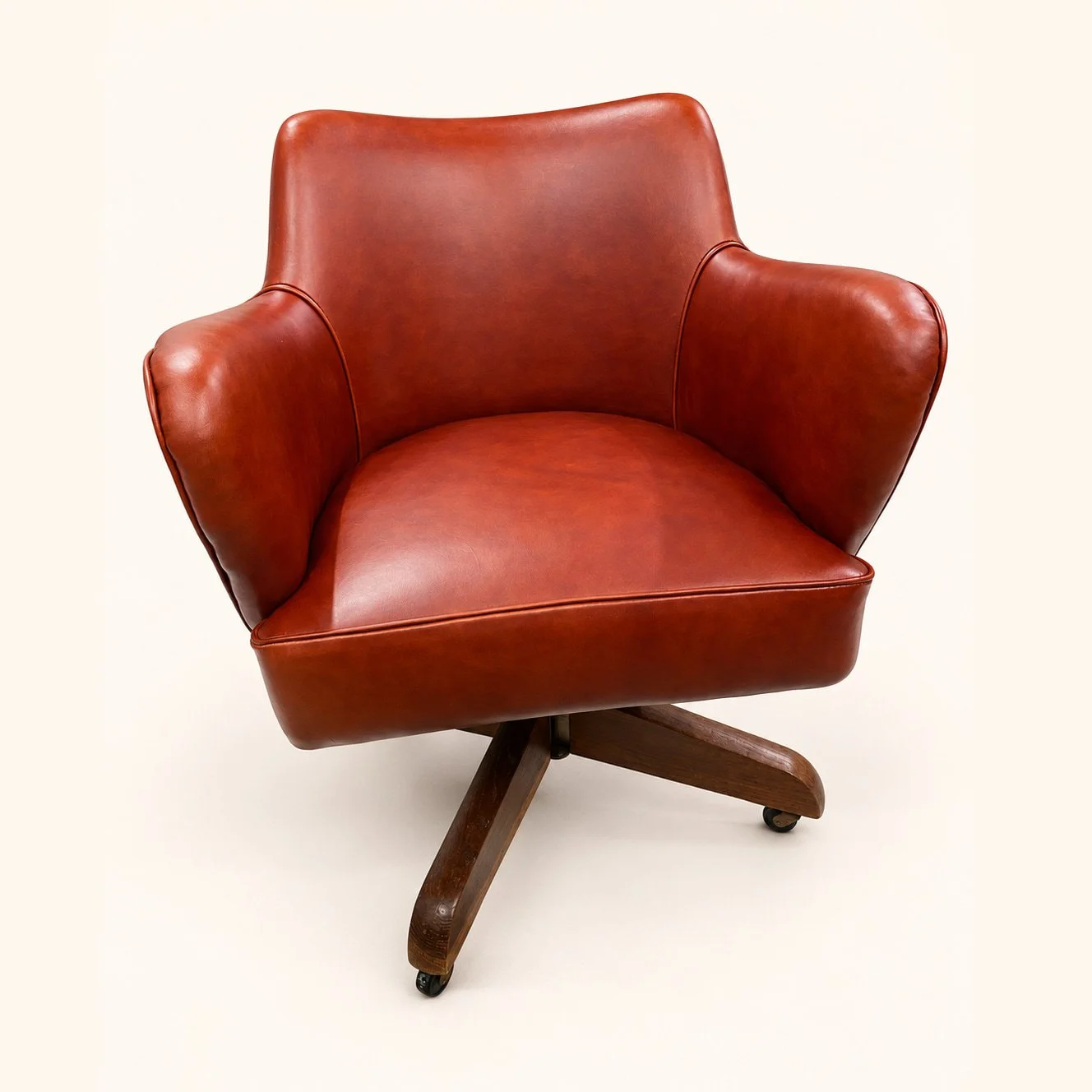 Mid-Century Swivel Chair after reupholstery in reddish-brown leather, with curved arms and a wooden four-point base.