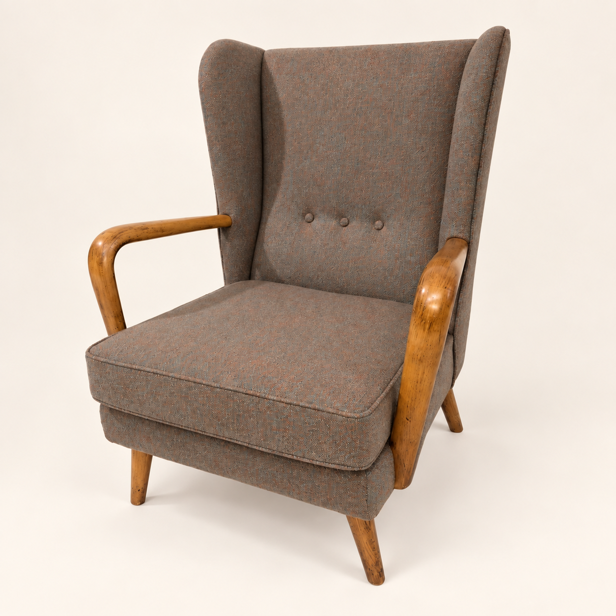 Howard Keith Bambino Chair in taupe upholstery, with a buttoned back, curved wooden arms and wooden legs.