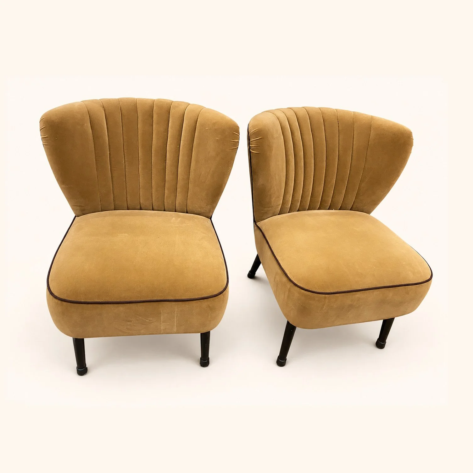 Cocktail Chairs before reupholstery in mustard fabric, with channelled backs, dark piping and dark wooden legs.
