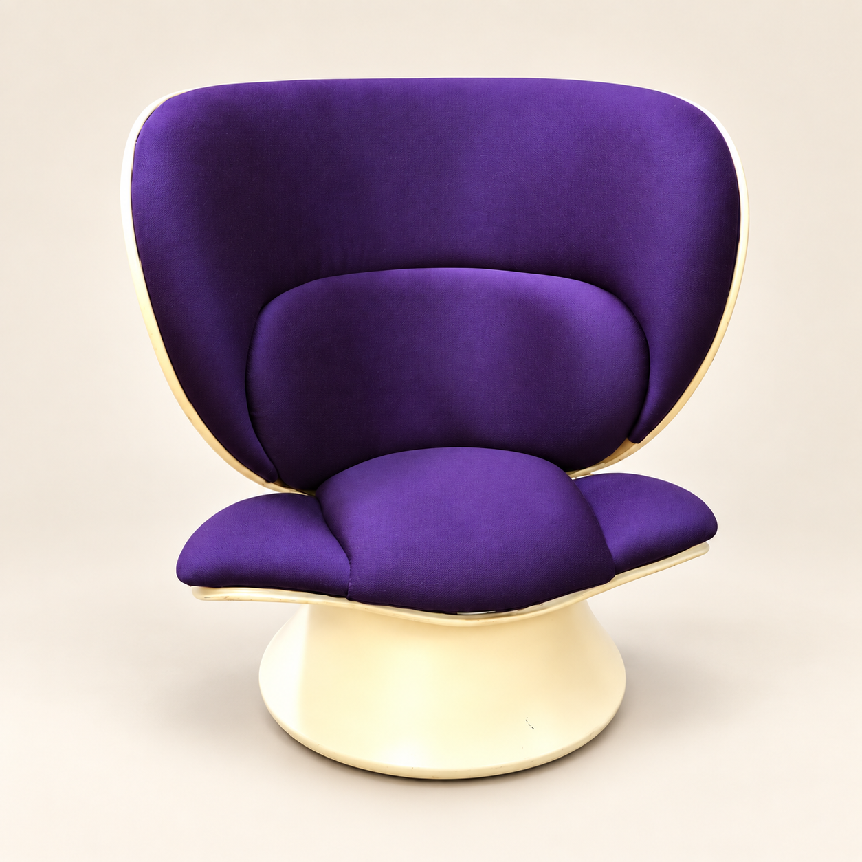 Purple upholstered sculptural swivel chair with rounded seat and back