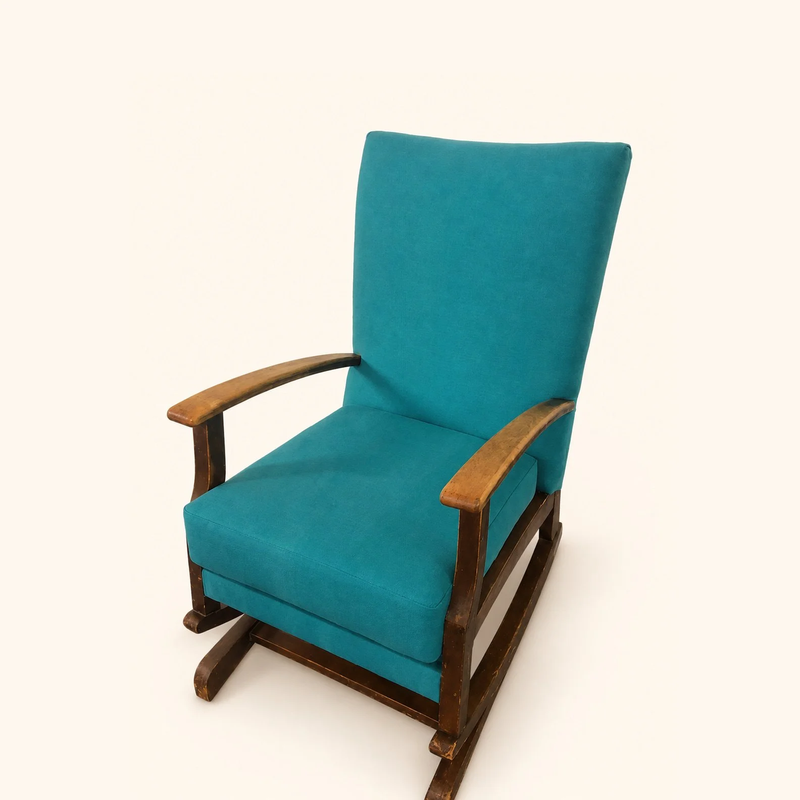 After reupholstery: wooden rocking chair with teal upholstered seat and back.