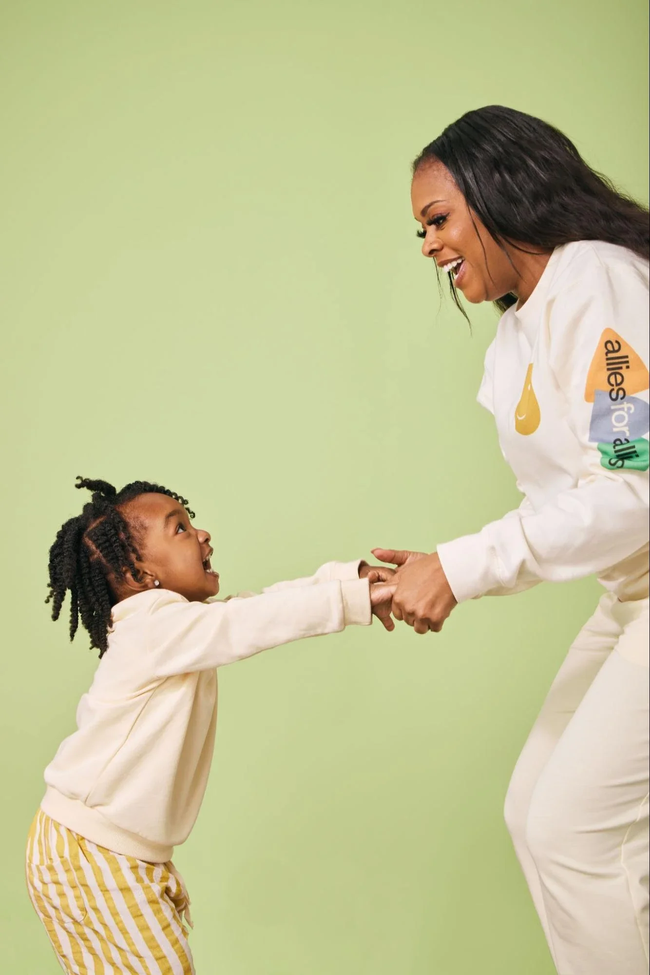 Caregiver and child laughing together
