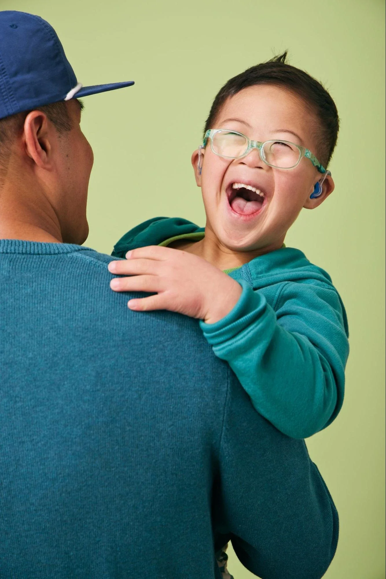Father holding his smiling son