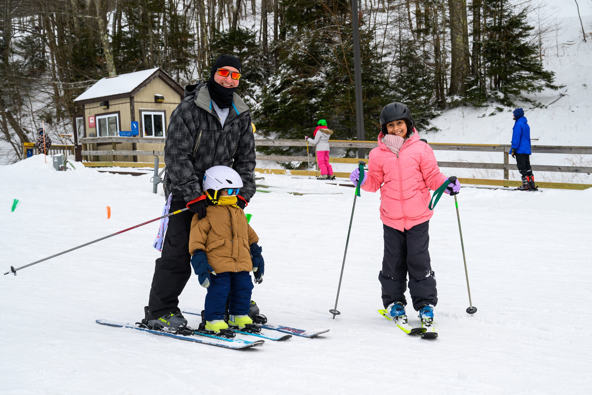 Family skiing during Special Love Winter Weekend