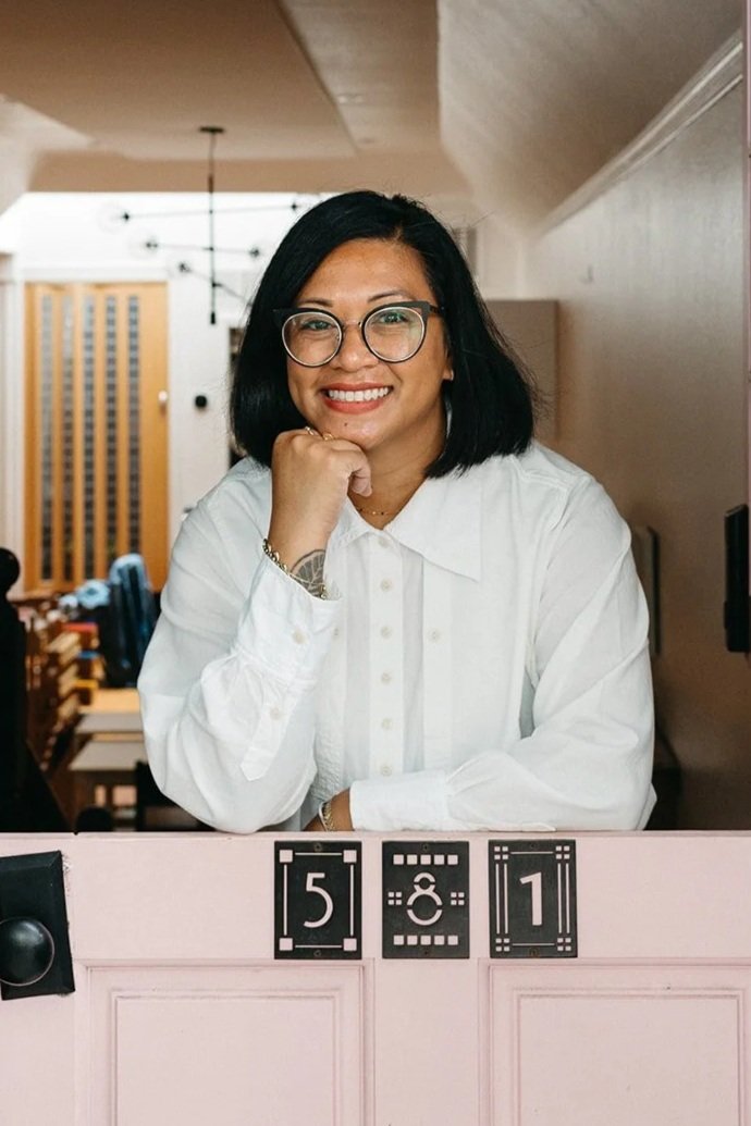 Headshot of Root Founder Michelle San Agustin in doorway