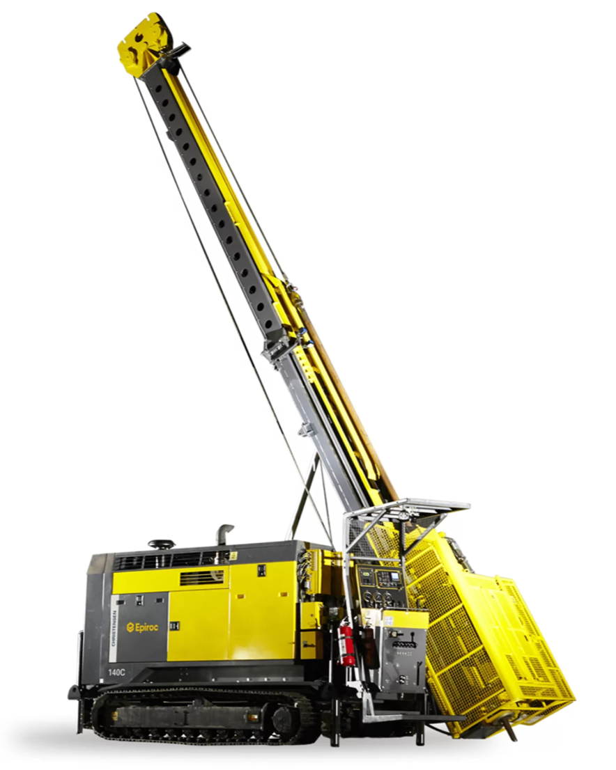 A large yellow and gray industrial crawler crane with a long boom extended upward.