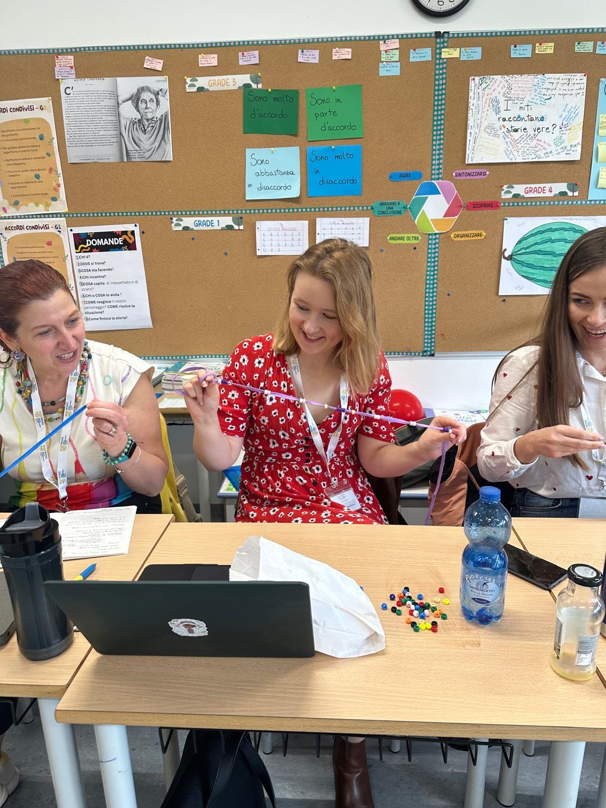 Teachers exploring small resources during Getting Ready to Write training in Madrid.