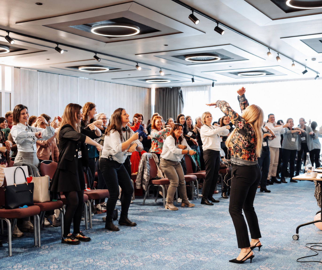 Alexandra Chiorando leading practitioners in an active movement exercise during an early years training workshop.