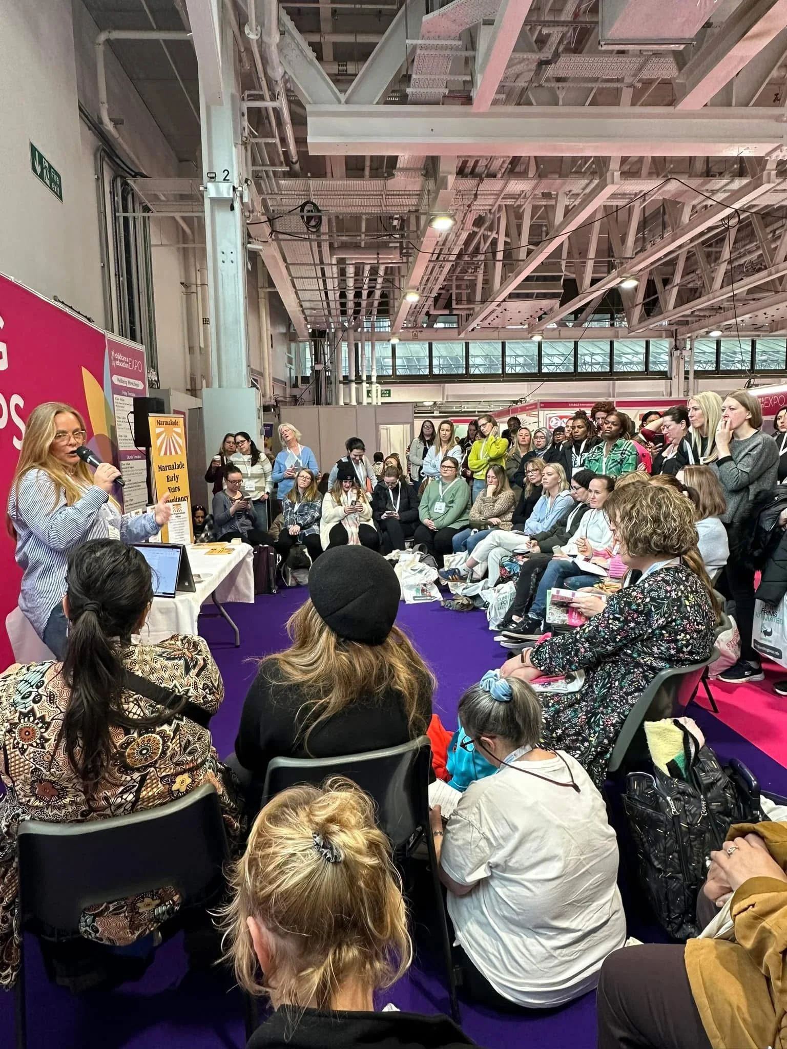 Audience taking part in an early years workshop at the Childcare and Education Expo in London.