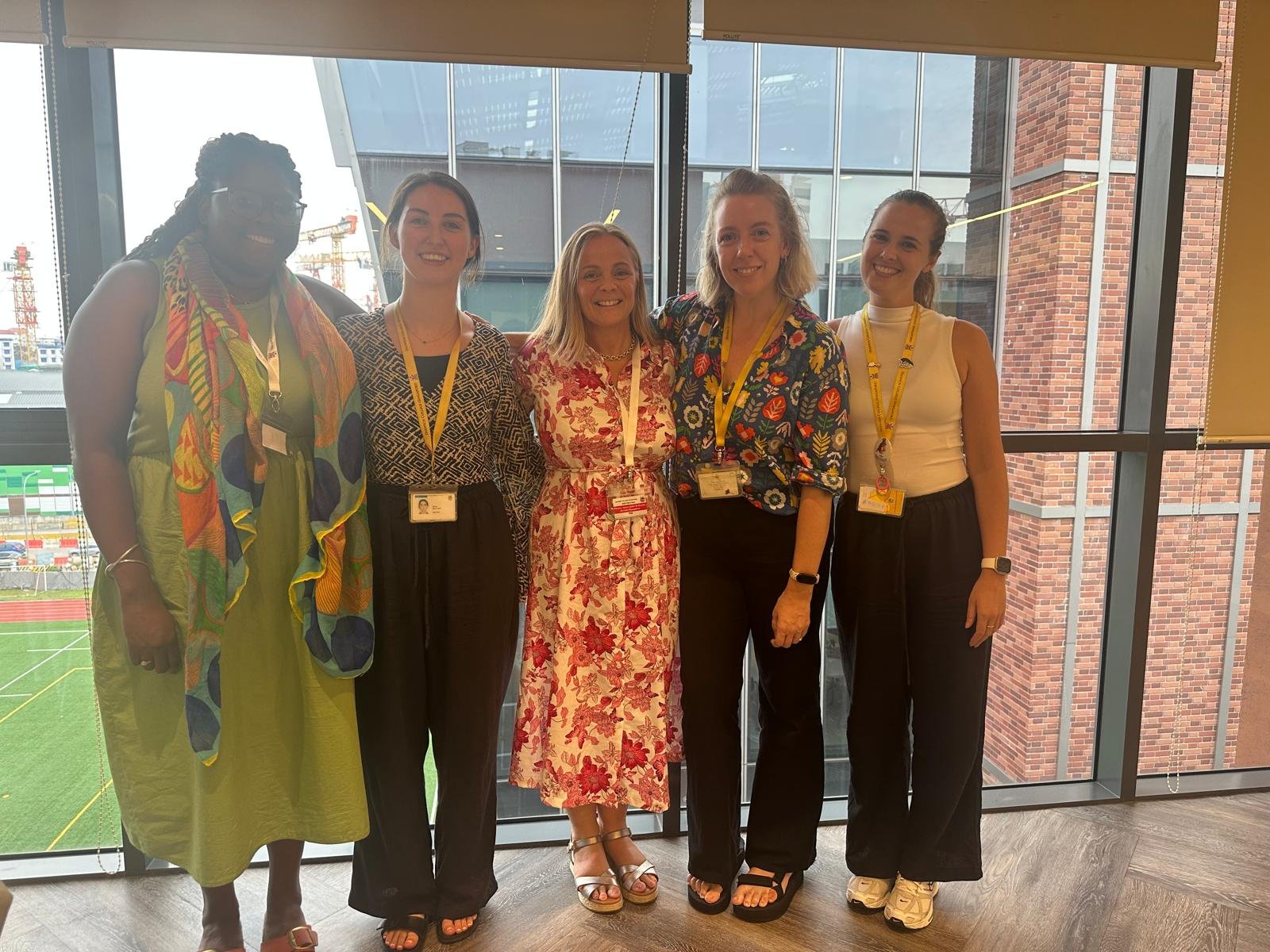 Four participants together at an early years training event.