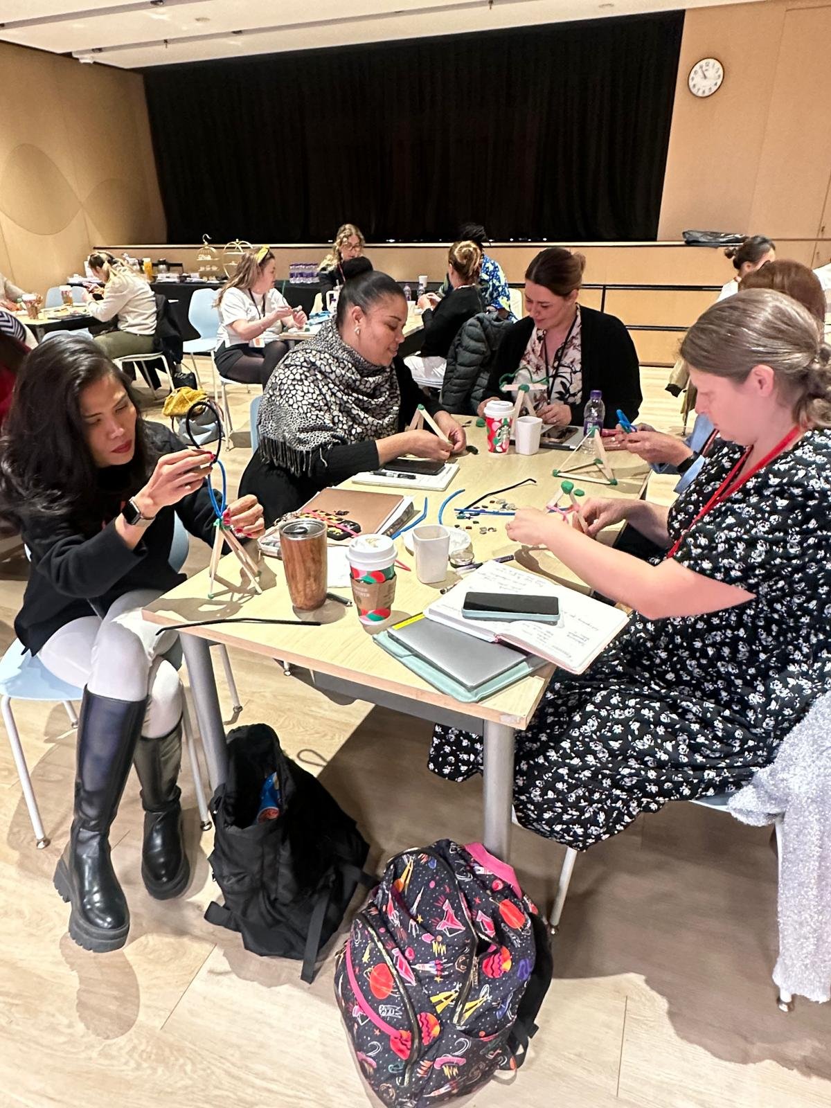 Practitioners exploring materials at Practical Early Maths Through Play training in Shanghai.