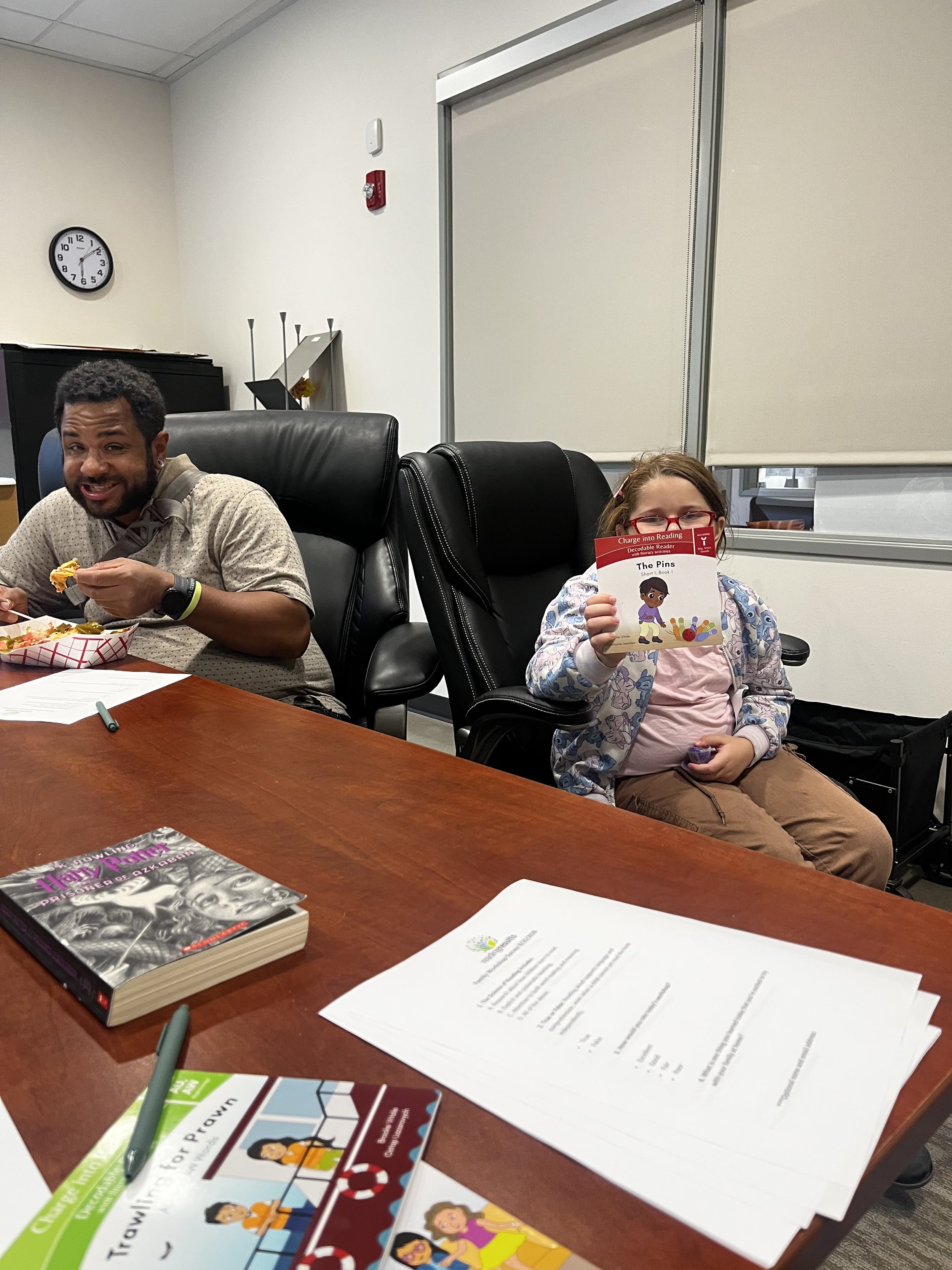 student showing off a new free book