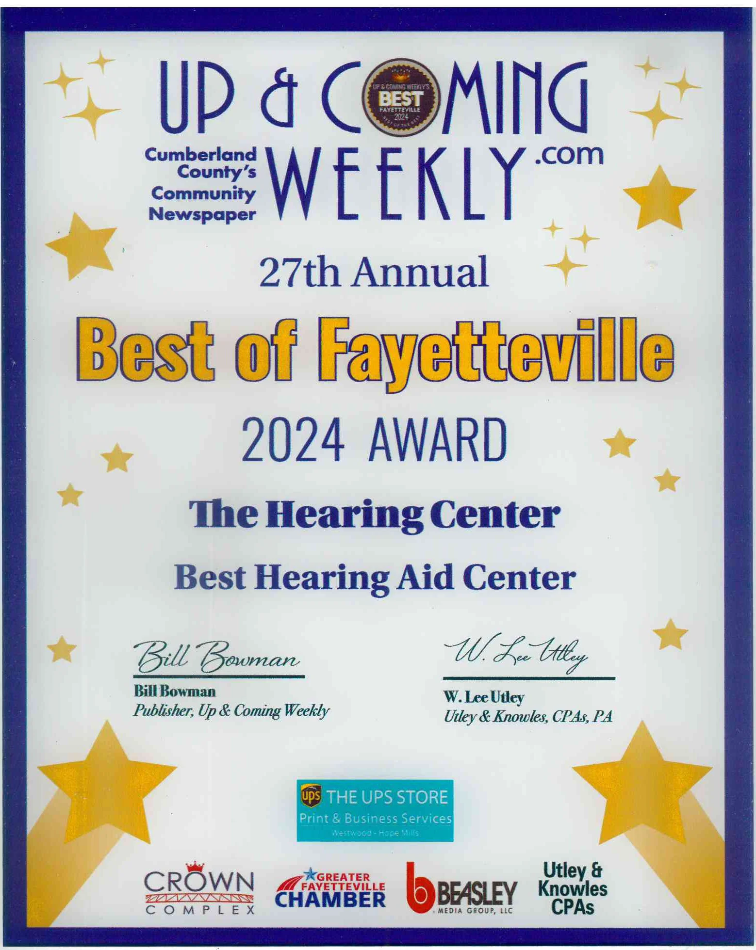 Certificate of recognition awarded to Best of Fayetteville for 2024 by Up & Coming Weekly, presented at the Hearing Center and Hearing Aid Center, with signatures of Bill Bowman and W. Lee Utley, and logos of various sponsors including UPS Store and local chambers of commerce, decorated with gold stars.