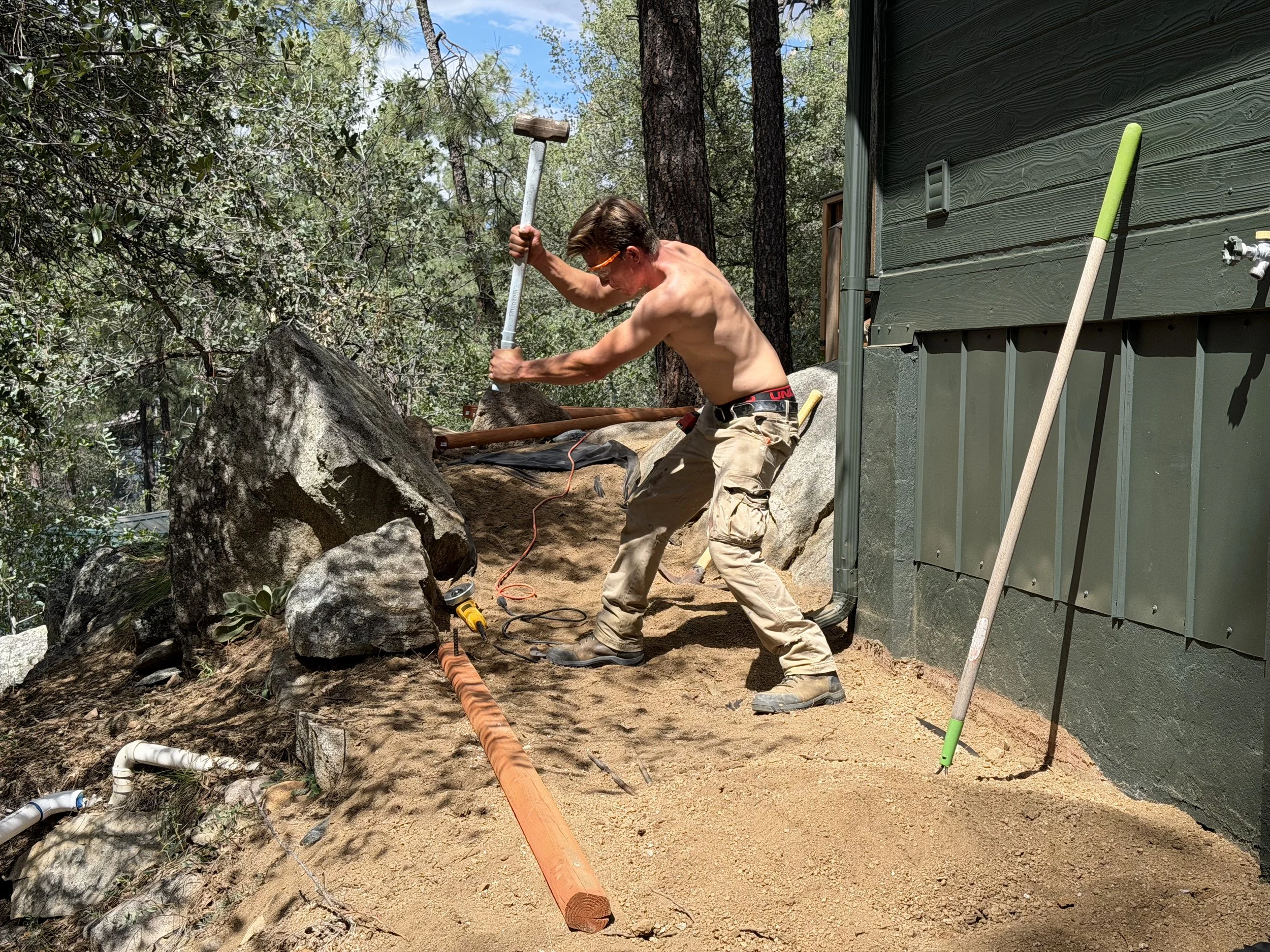 Boulder removal during a cabin renovation and property improvement project in Prescott, Arizona.
