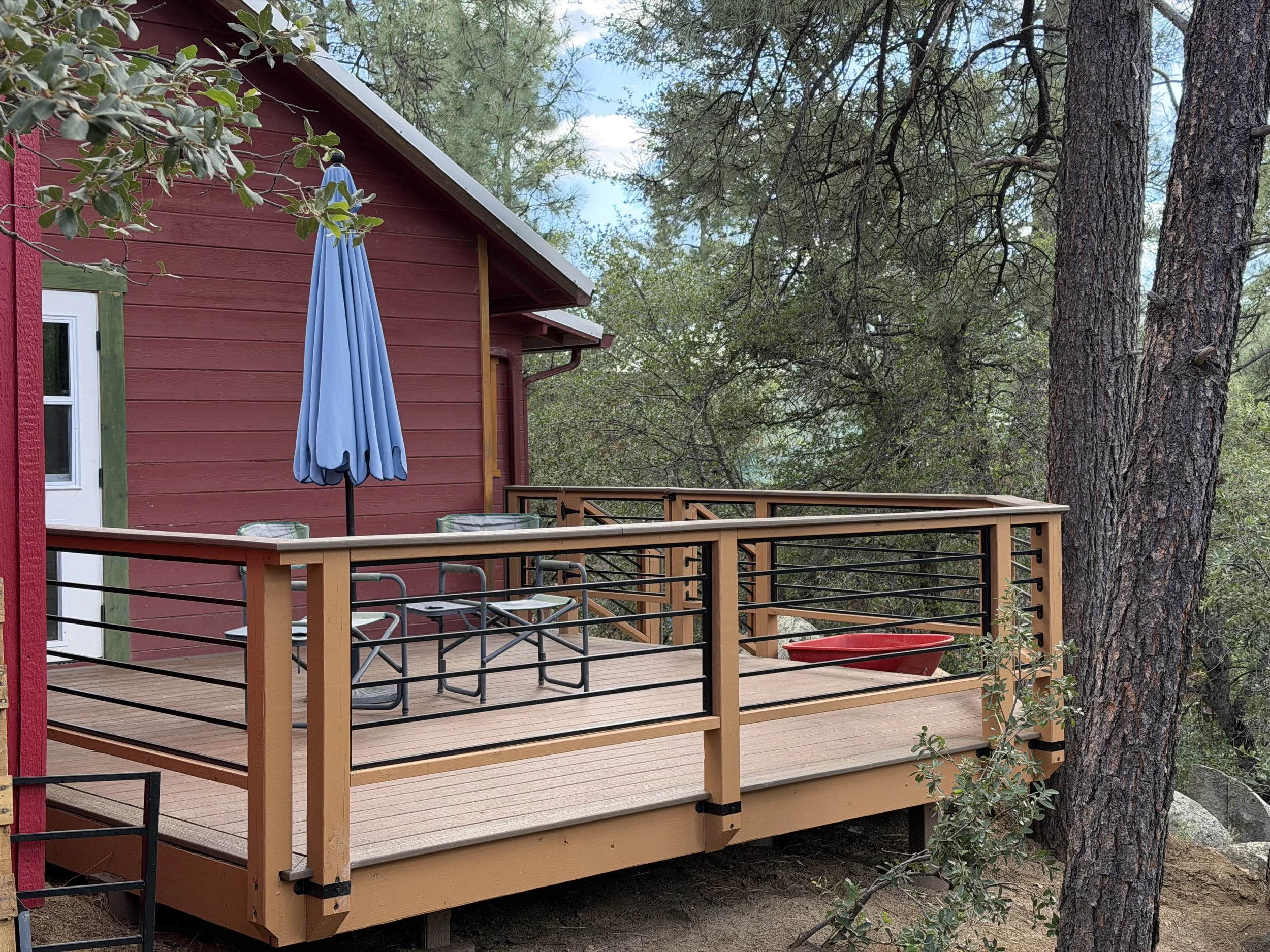 Finished custom deck at a Prescott, Arizona cabin renovation project.