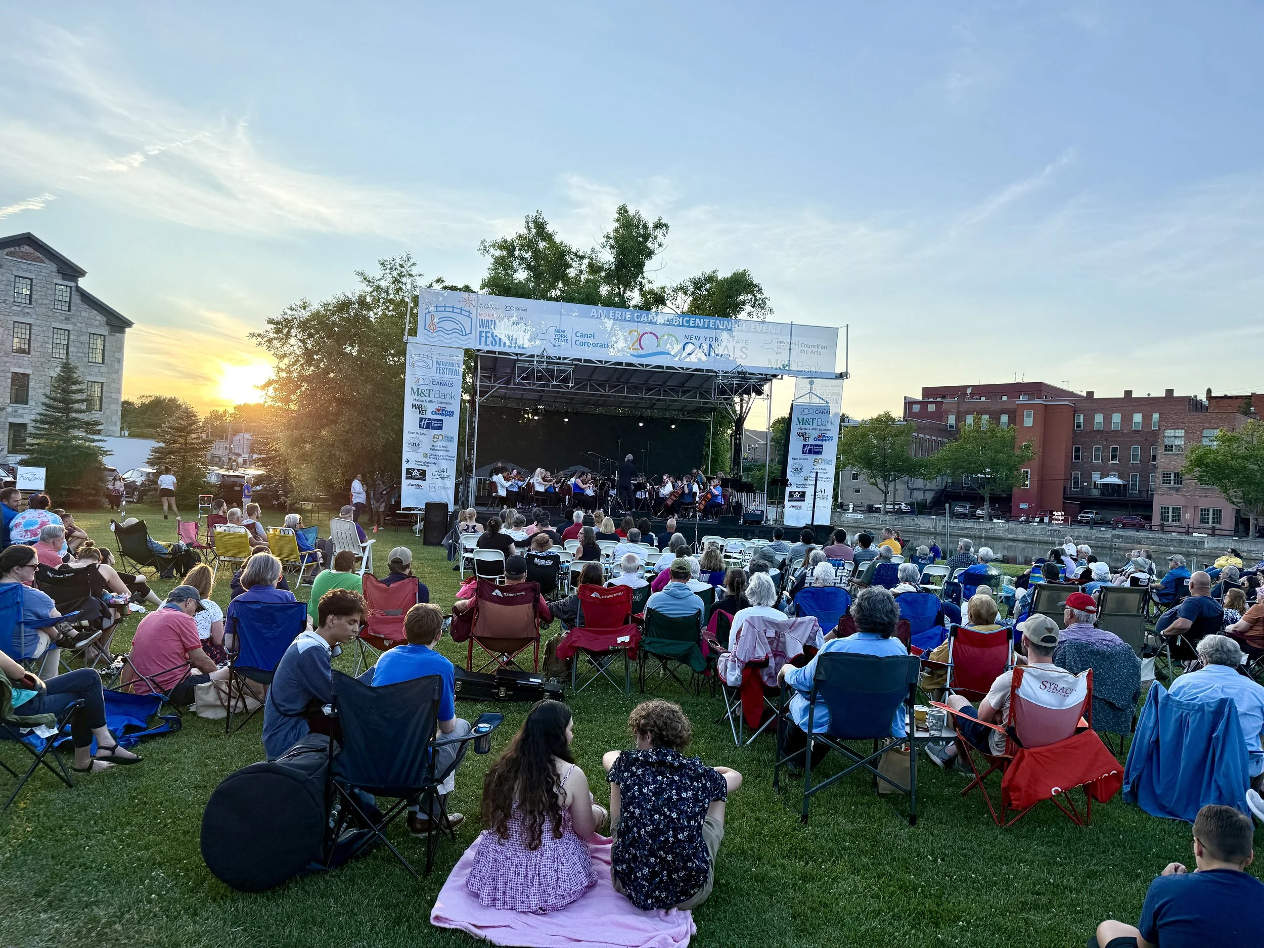  Seneca Falls residents enjoying a free canalside concert on July 4, 2025 