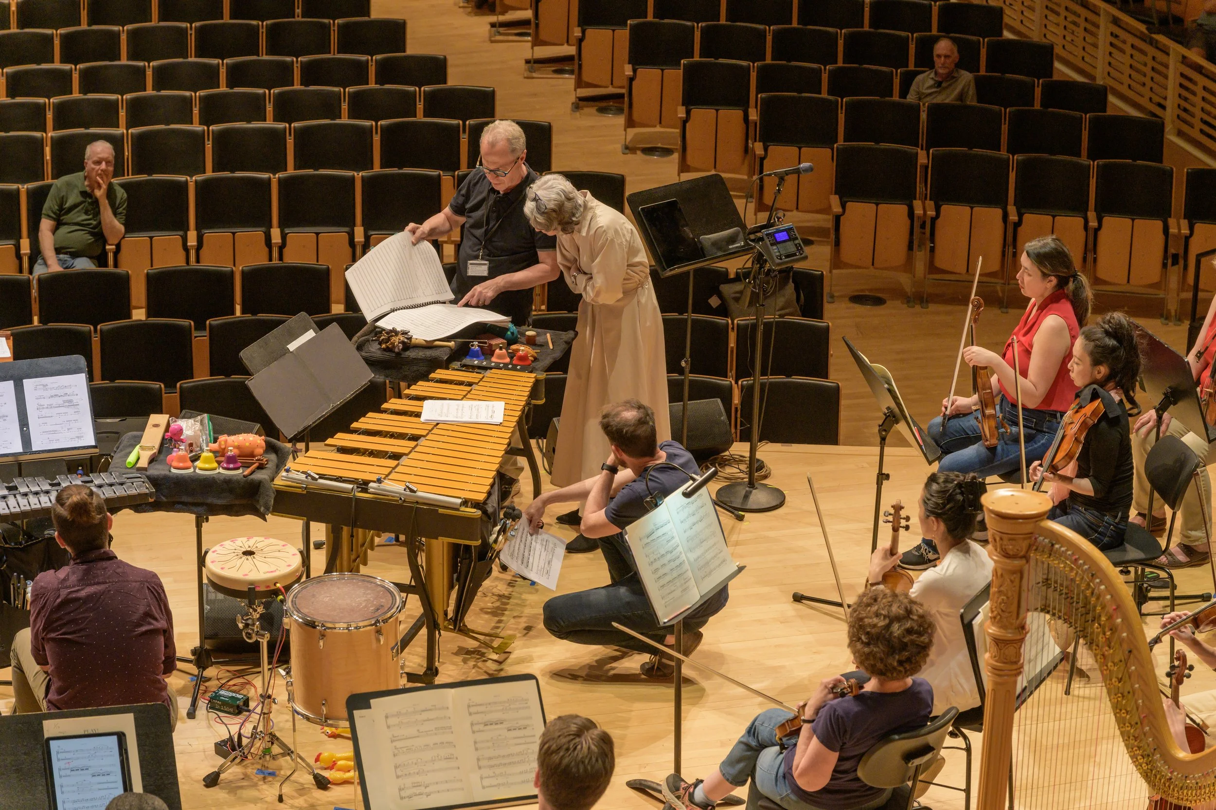  Composer Clarice Assad reviews a score with David Alan Miller during the Open Rehearsal at EMPAC Concert Hall June 5, 2025 PC: Gary Gold Photography 
