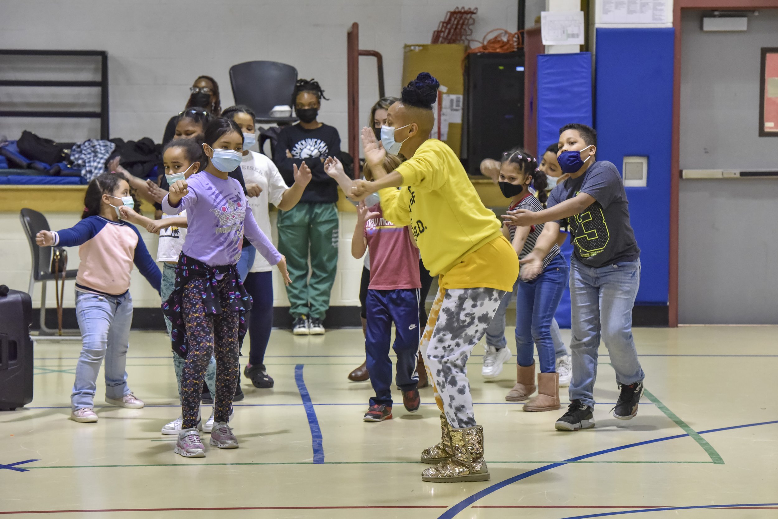  Adia dancing with students. 