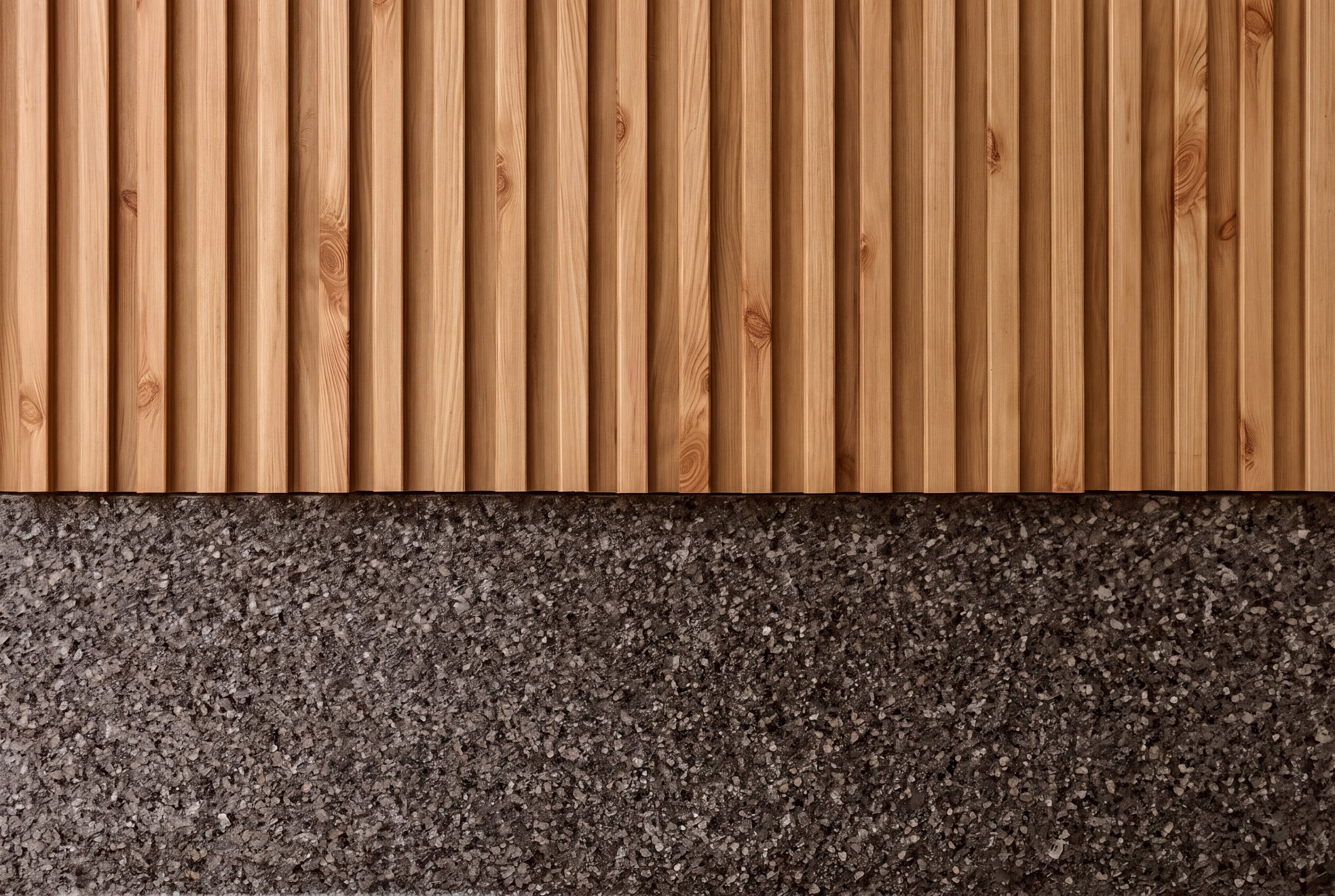 luxury garage finishes including wood slat wall and epoxy flooring