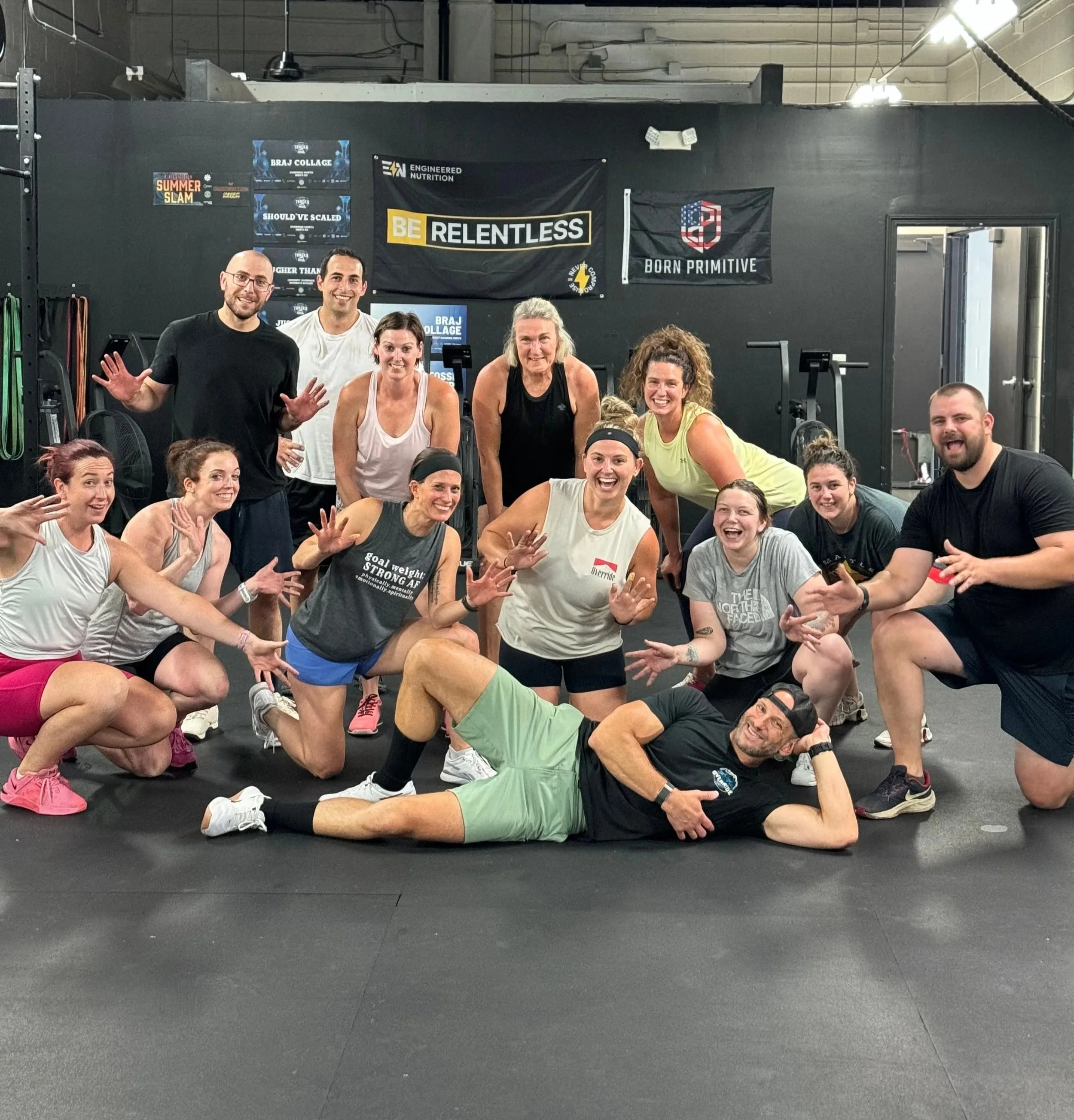 Override North members and coaches in Avon, CT smiling together after a group fitness workout.