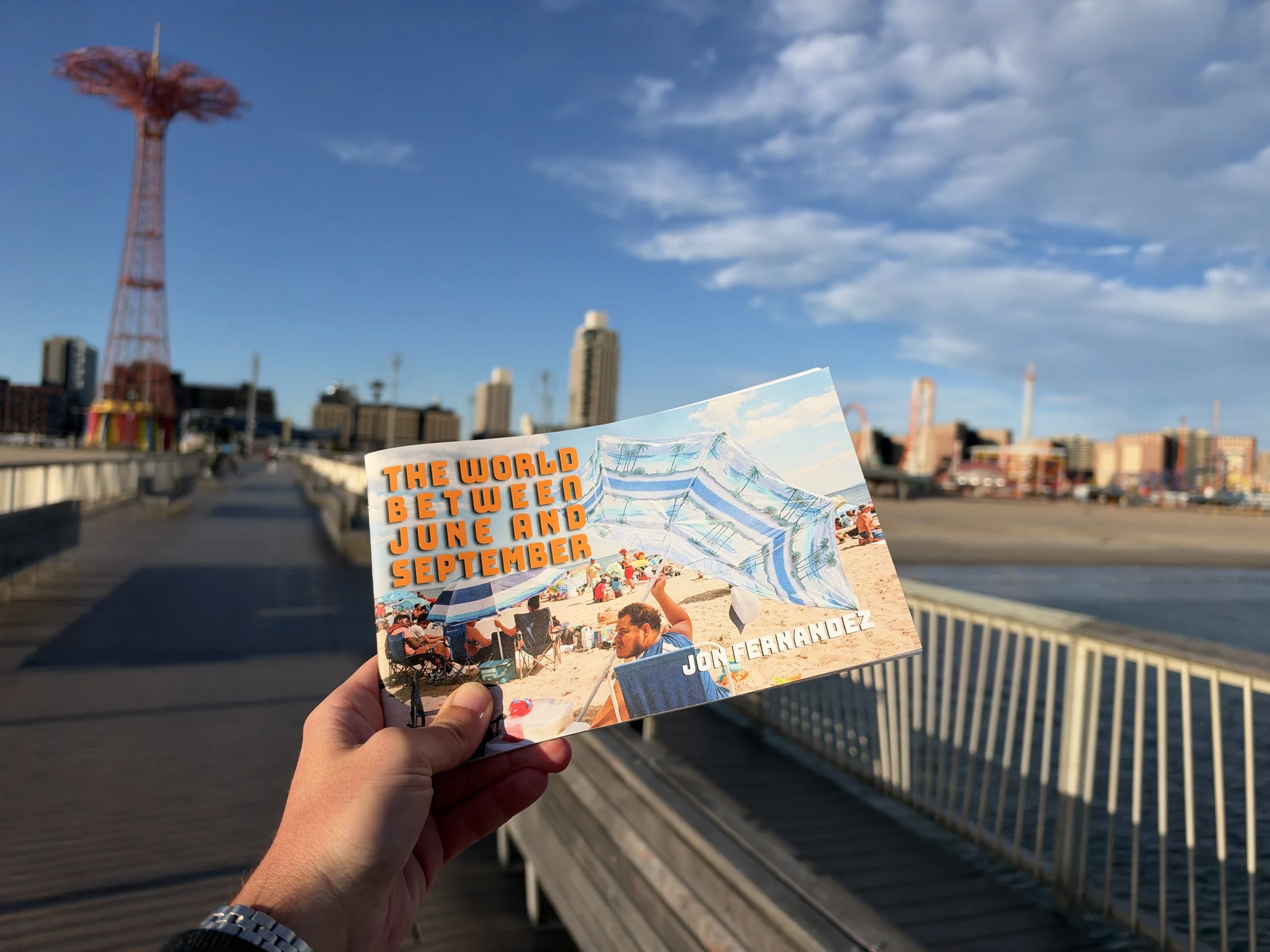 The cover of my Coney Island Zine, with Coney Island in the background. The cover title is The World Between June and September