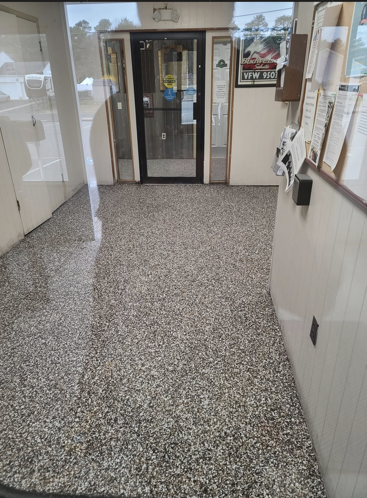 Speckled epoxy floor.