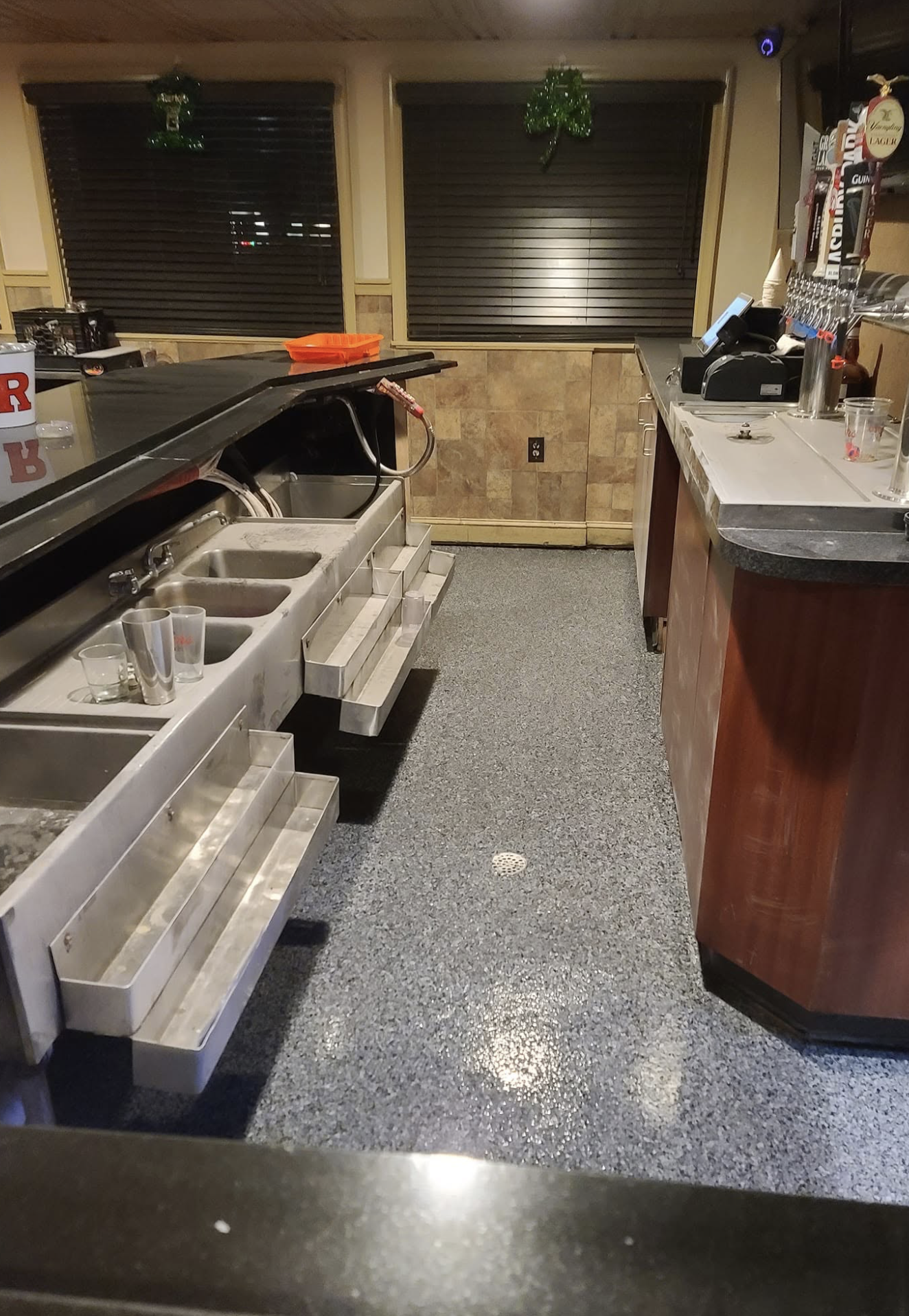 Custom epoxy floor behind bar.