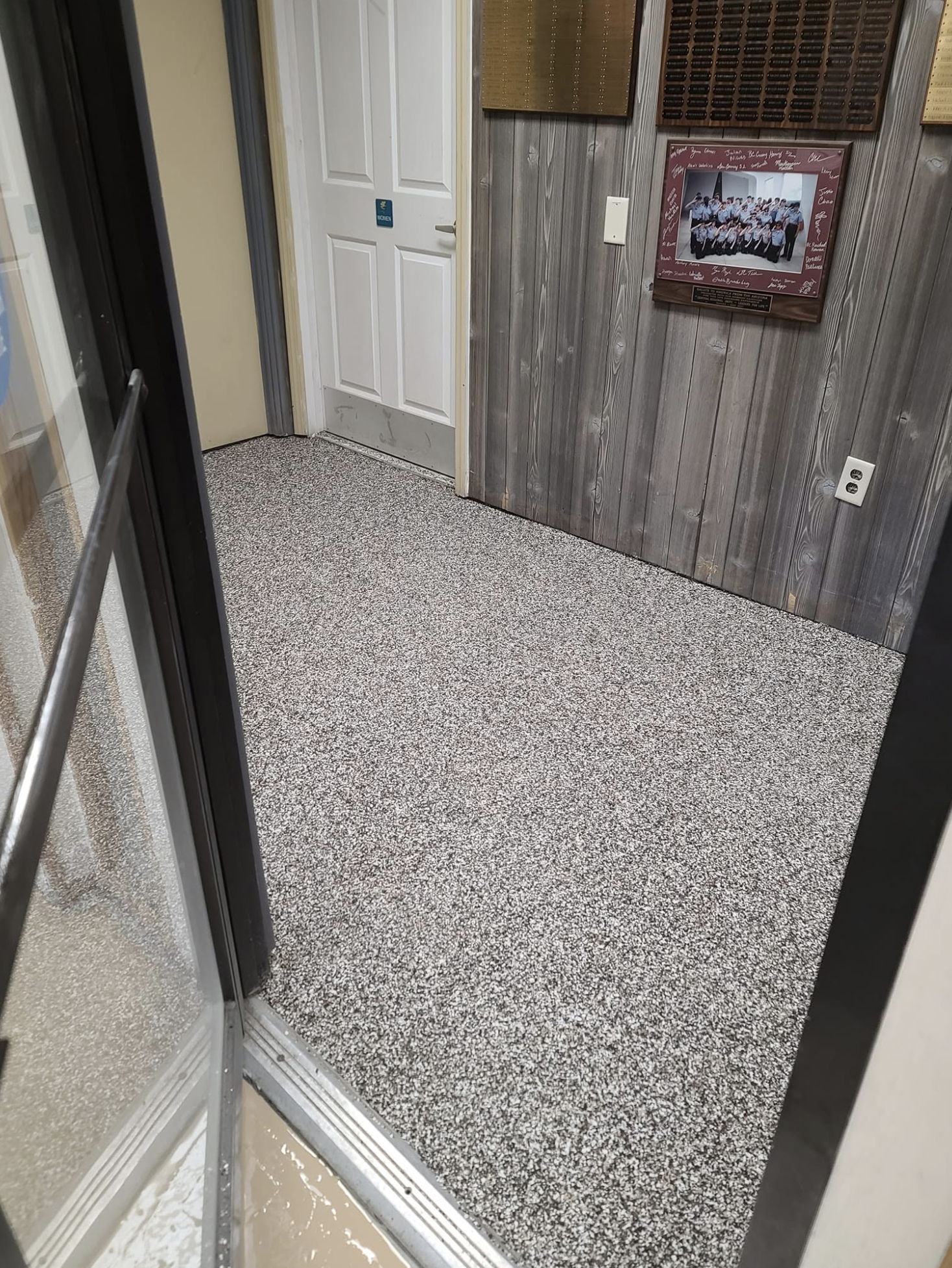 Gray speckled epoxy flooring.