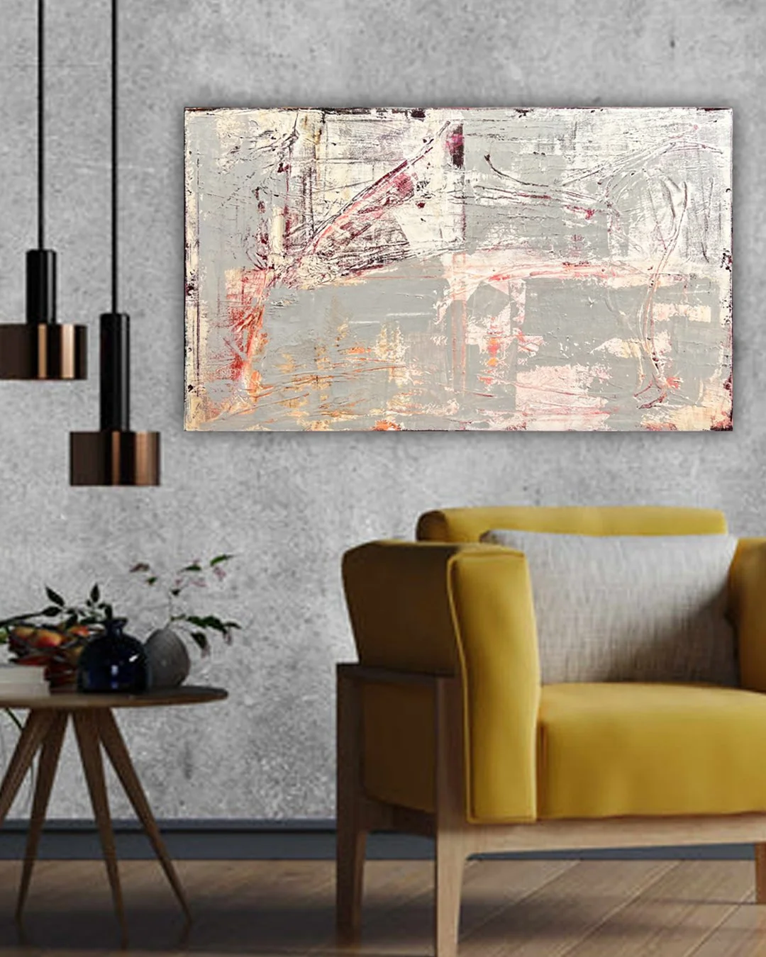 Modern living room with abstract art painting on light gray wall, yellow armchair, small round wooden side table with vases and leaves, and black and copper pendant lights.