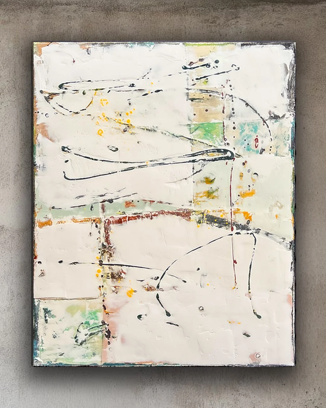 Abstract painting on canvas with white background, accented by splashes of yellow, green, orange, and black, featuring freeform lines and shapes.