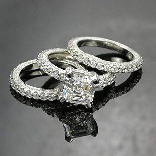 Three coordinating custom rings with clear stones.