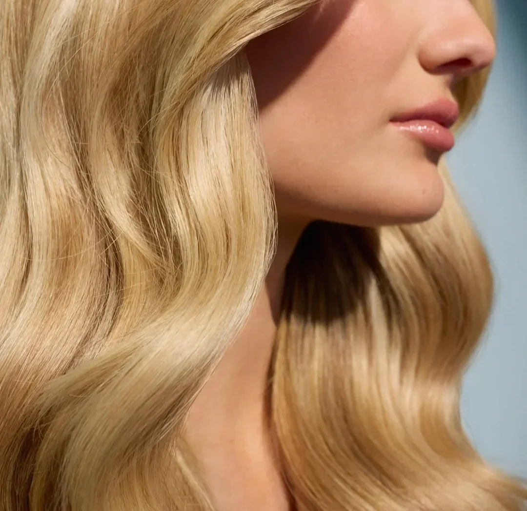 Close-up of a woman's healthy hair following supplemental hair growth treatments at a med spa.
