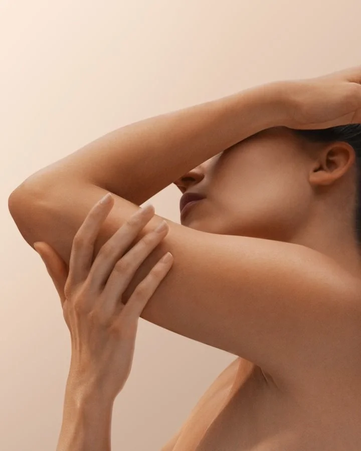 A woman with smooth skin after a laser hair removal treatment.