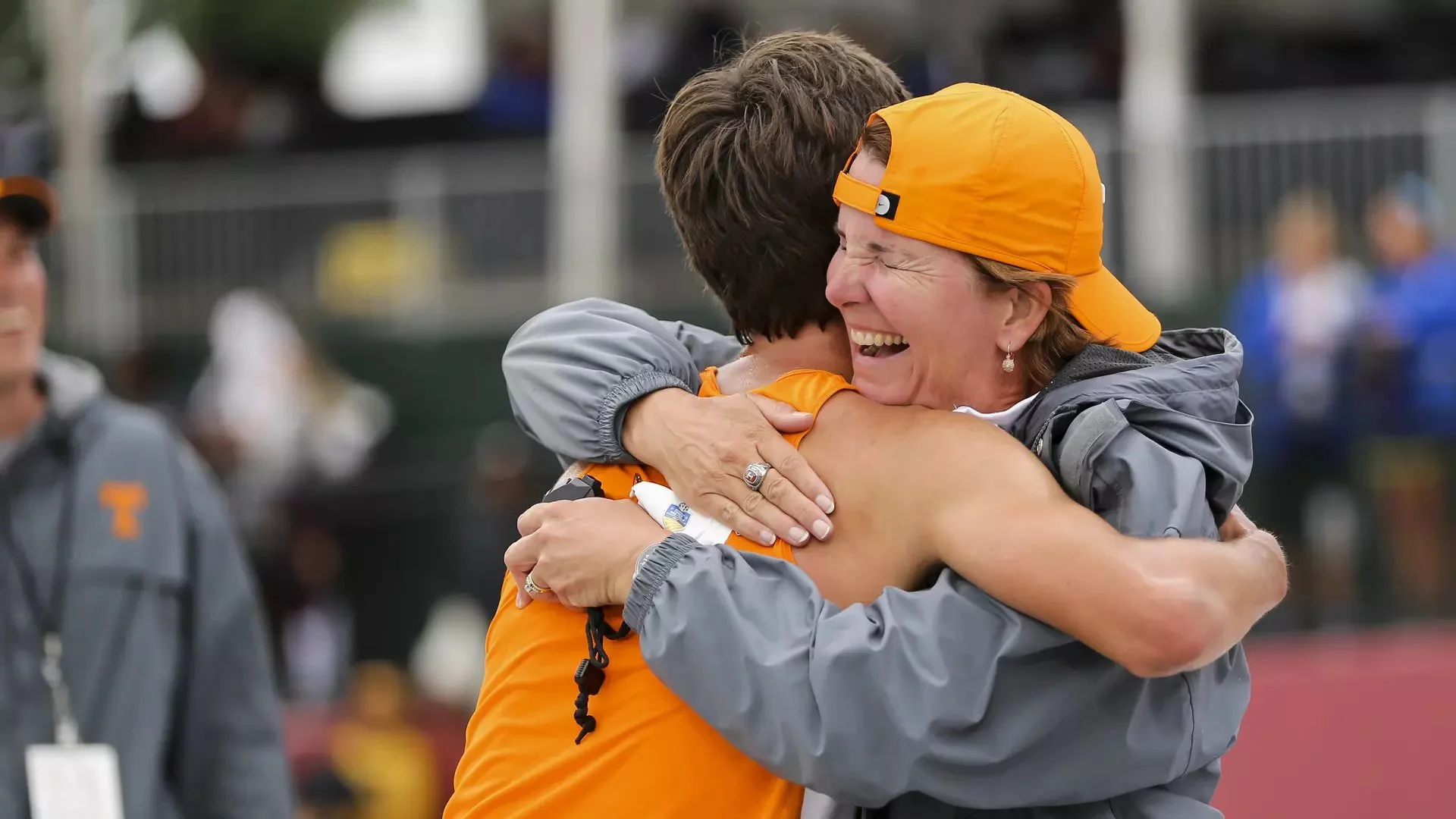Beth Alford-Sullivan hugs a Tennessee athlete after a race