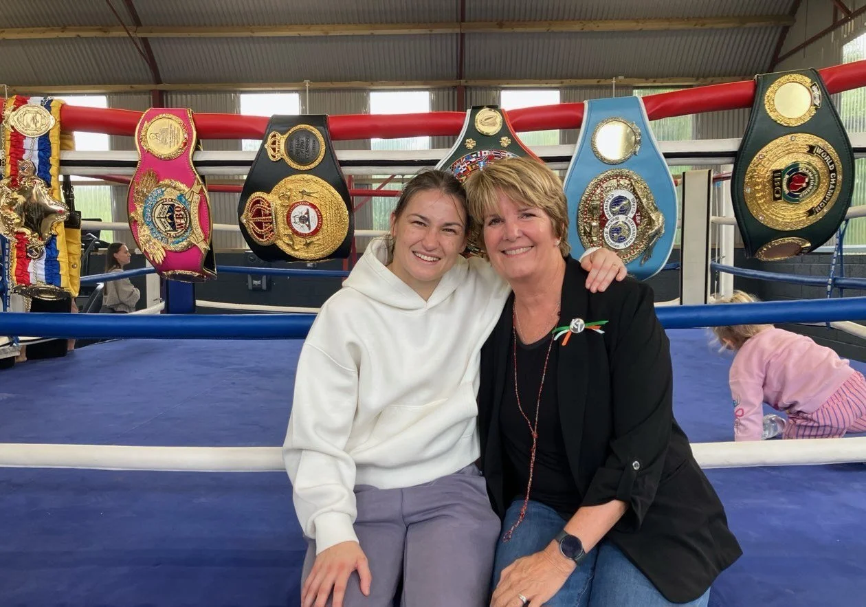 Beth Alford-Sullivan and Katie Taylor ringside at a boxing gym