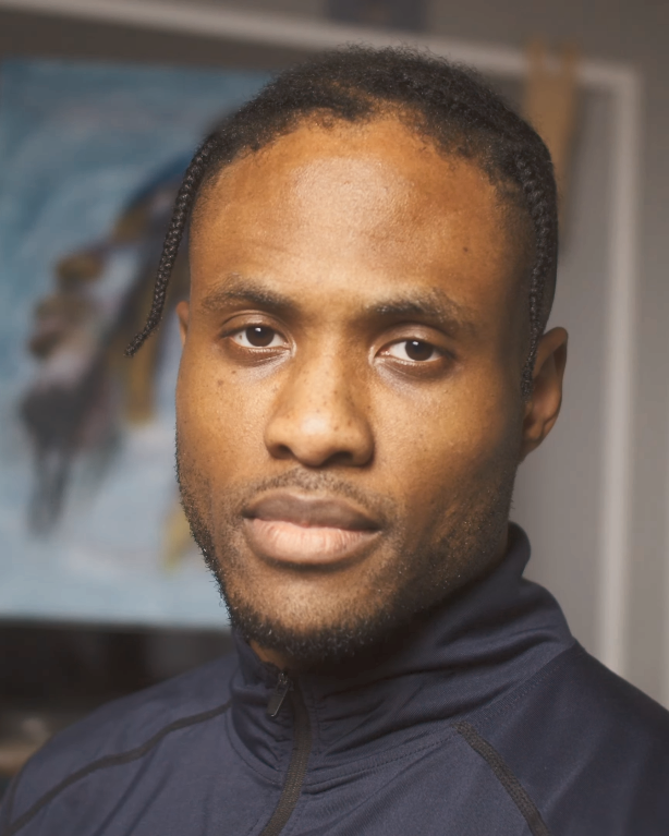 Portrait photograph of Stanley Onah looking directly at the camera with a neutral expression.