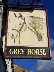 Sign featuring a drawing of a grey horse head and neck with the words 'GREY HORSE' underneath.