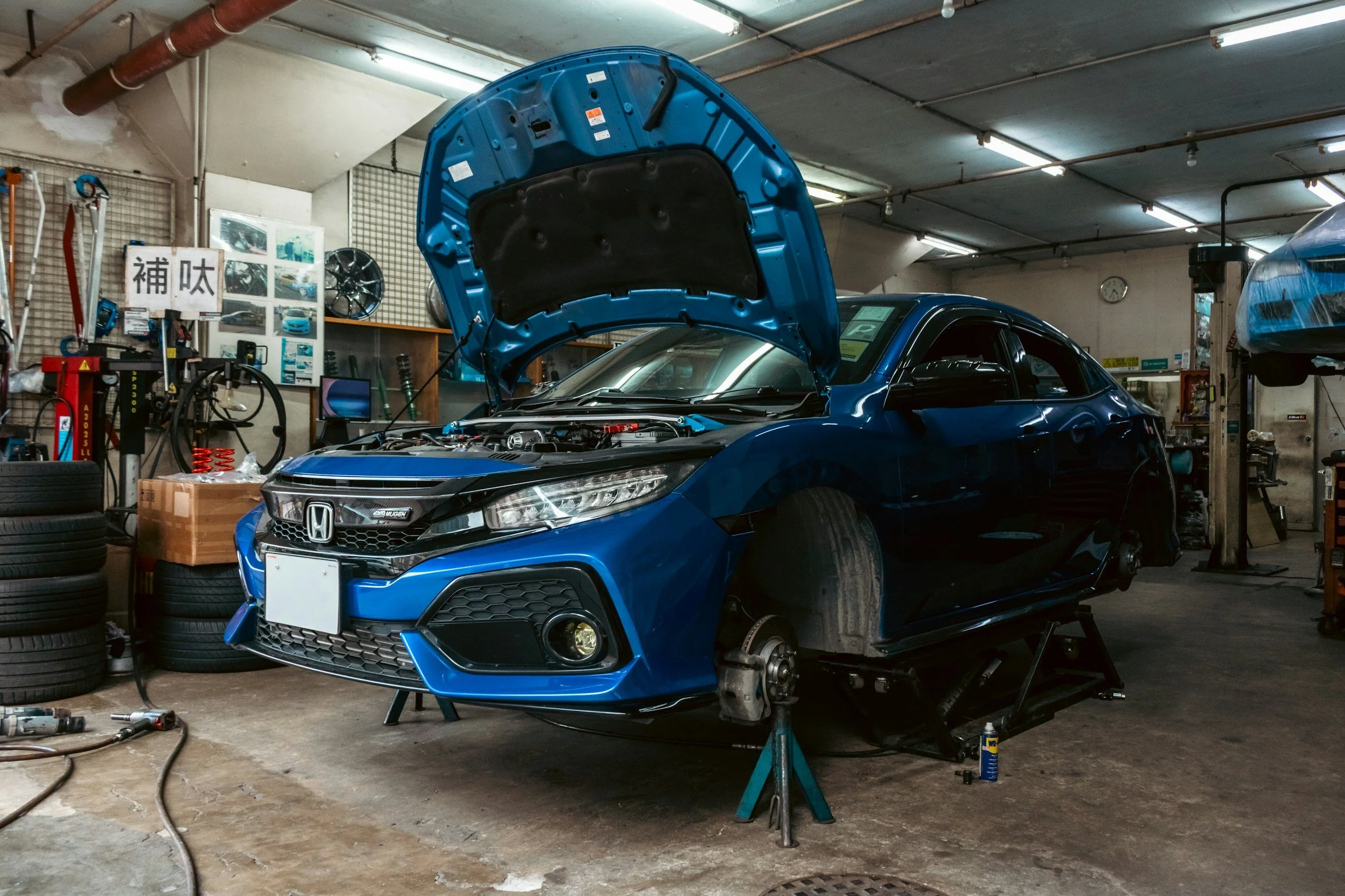 Vehicle in a Central Texas repair bay being prepped for ADAS calibration